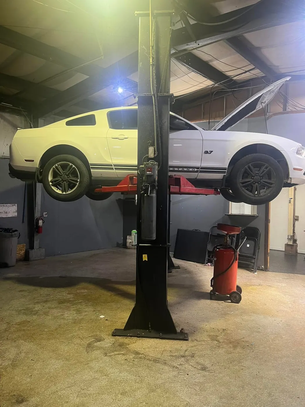 Vehicle on the shop lift during service