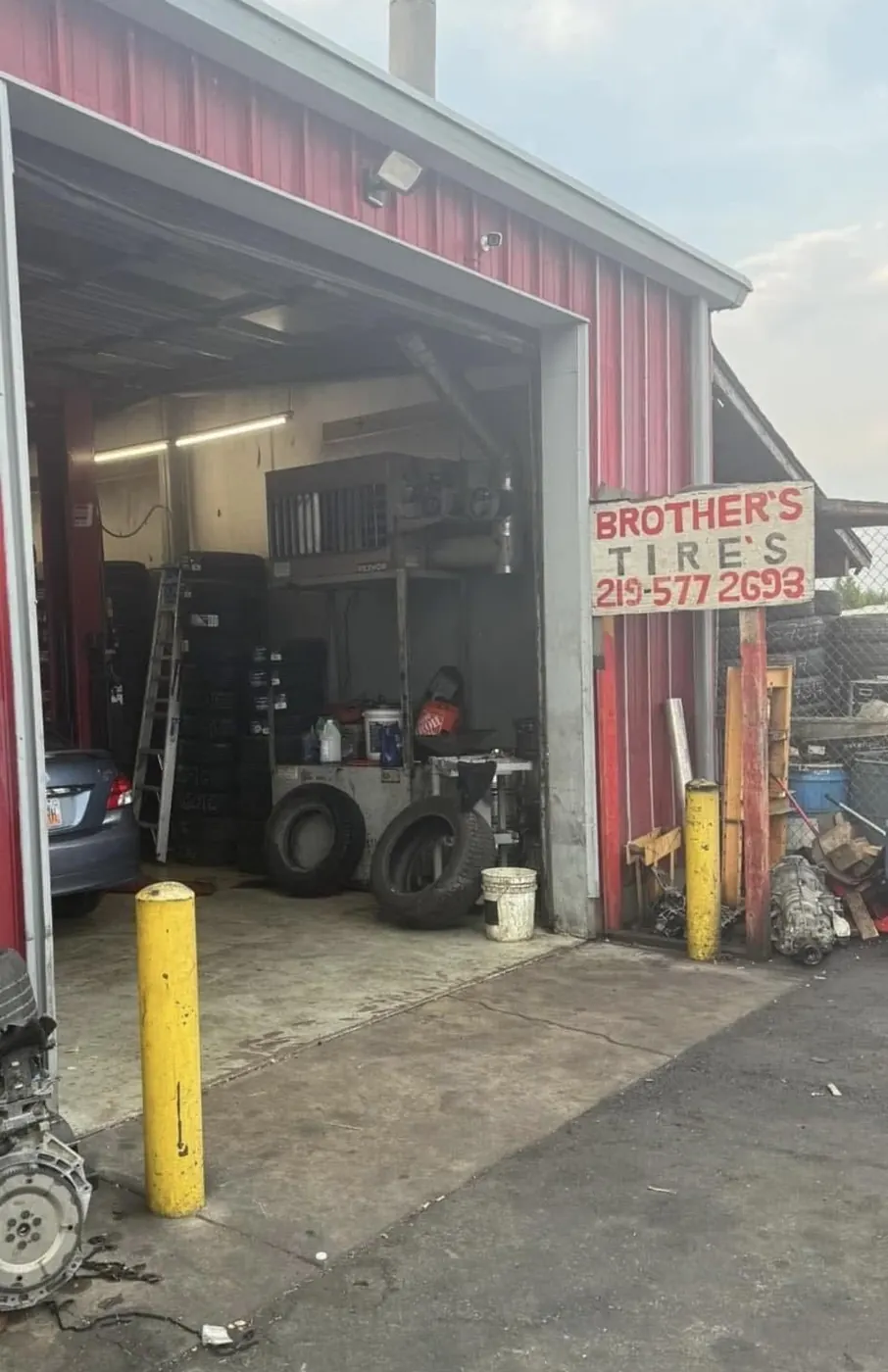Service bay door open with equipment inside