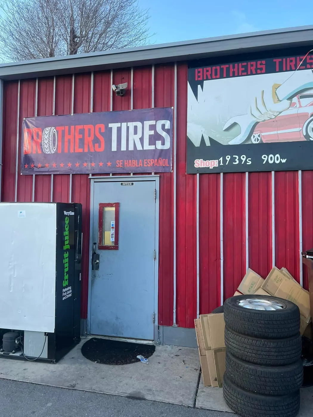 The Brothers Tires of Utah shop sign above the red service building